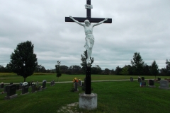 Stutue of Jesus on the cross in the middle of the cemetery