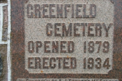 Plaque on a pillar at the entrance to the cemetery giving the date it was opened in 1879.