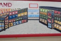 Part of the mural on side of Foodland showing the inside of a grocery store.